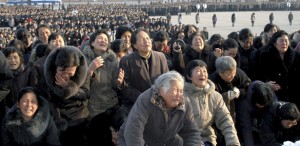 North Koreans cry in front of the Statue of the Sun in Pyongyang in this picture released by the North's official KCNA news agency